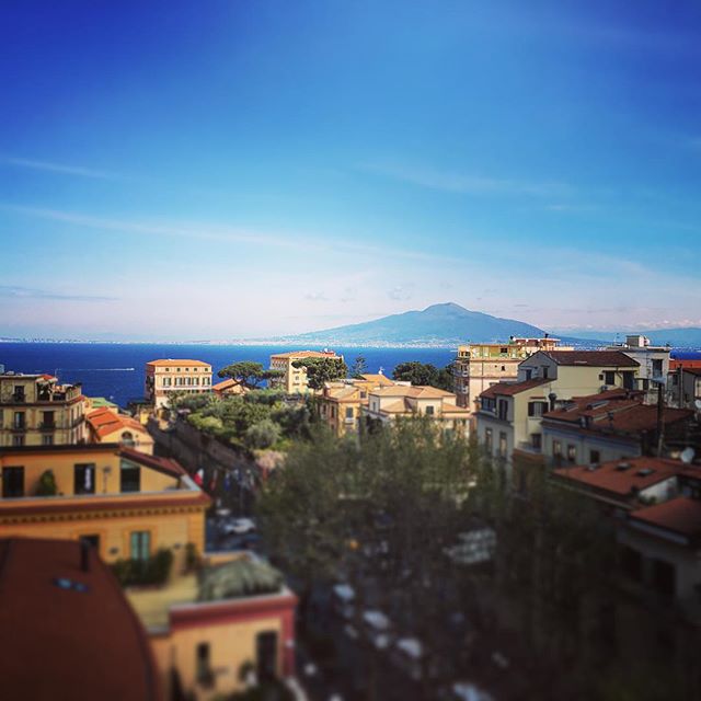 ''Tis a hard life, sitting here on the roof top reading a book and having Mount Vesuvius in the distance