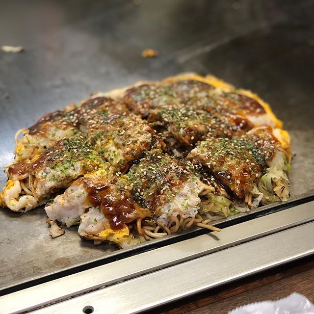 More okonomiyaki - this time Hiroshima style... unlike traditional Osaka okonomiyaki this is built in layers and includes noodles.