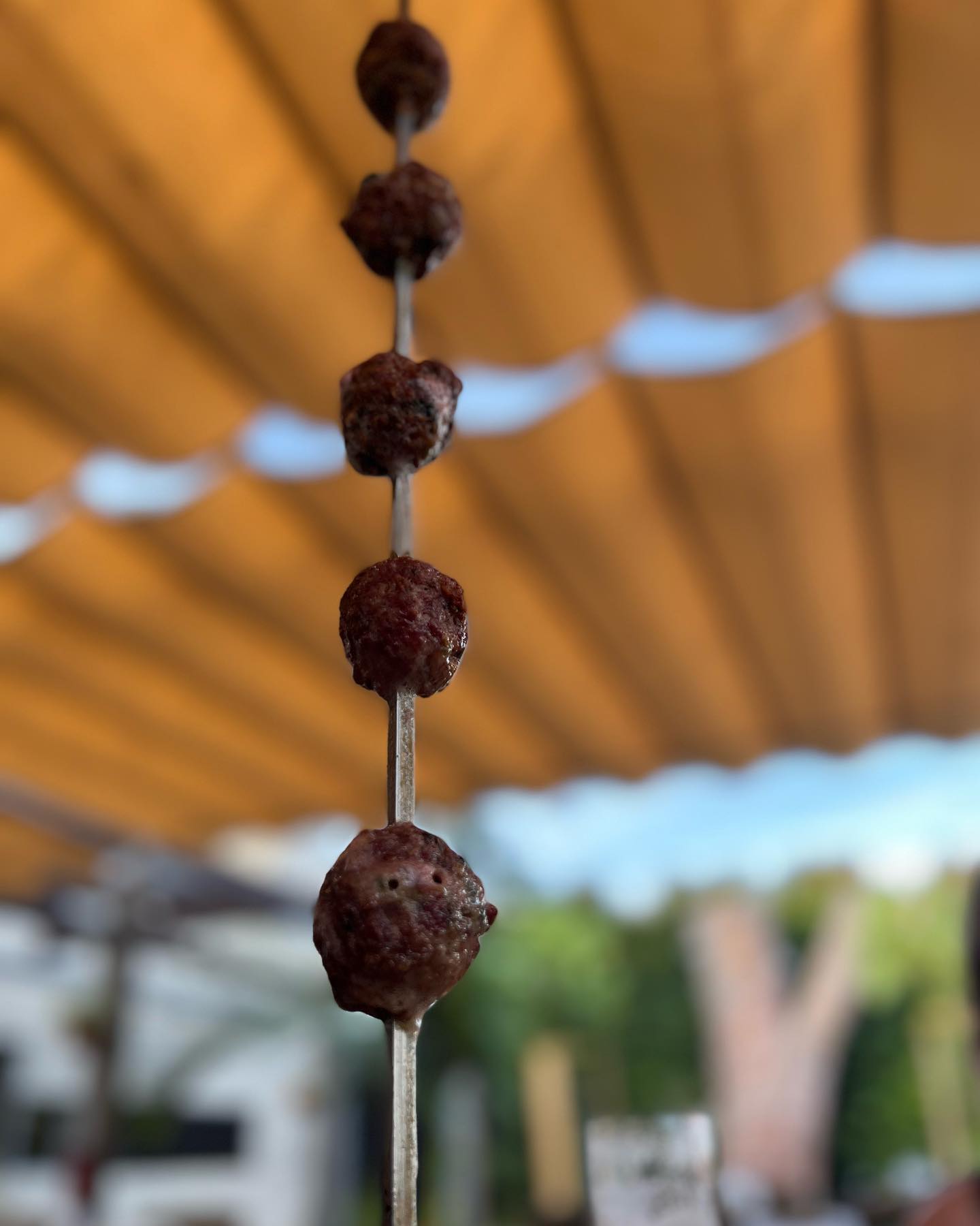 There is something deeply satisfying having your dinner hang from a skewer… and the restaurant also being a butchers!